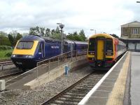 South West Trains DMU 158881 is stabled in Swindon's west end up side bay on 12 June as 43130 leaves platfom 1 leading the 10.36 ex Paddington service to Cheltenham.<br><br>[David Pesterfield 12/06/2013]