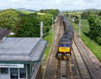 Compass Tours charter from North Berwick to Morecambe (via the Cumbrian Coast) hauled by WCRC 47854, crosses to the down line at Hest Bank before taking the branch to Bare Lane on 15 June 2013.<br><br>[John McIntyre 15/06/2013]