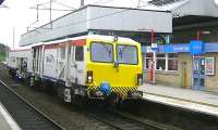 SB Rail track tamper DR73904 heads north through Oxenholme on 15 June 2013.<br><br>[Ken Browne 15/06/2013]