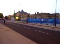 Cambridge station seen from the South-West at dusk in June 2013. This view was impossible while the grain warehouse (or flour mill?) stood in the way. The street in the foreground forms a non-guided part of the guided busway and has sensibly been kitted out with bus stops to relieve congestion at the end of Station Road.<br><br>[Ken Strachan 07/06/2013]