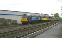 DRS 57010 leads Colas 56302 on 6K60 Ayr Falkland to Carlisle Yard through Kilmarnock station on 5 June.<br><br>[Ken Browne 05/06/2013]