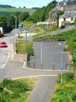 Looking north from a spot directly above Ladhope Tunnel, Galashiels, on 19 June 2013. The footbridge spanning the trackbed between Low and High Buckholmside stands in the middle distance.<br><br>[John Furnevel 19/06/2013]