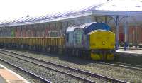 DRS 37194 with wagons for repair at Wabtec Barclay Works arriving at Kilmarnock on 5 June 2013.<br><br>[Ken Browne 05/06/2013]