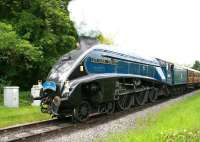 Scene on the North Yorkshire Moors Railway on 1 June 2013 as A4 60007 <I>Sir Nigel Gresley</I> brings a train over New Bridge level crossing on the approach to Pickering.<br><br>[John Furnevel 01/06/2013]