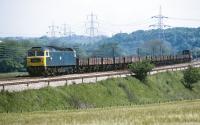 Brush Type 4 No 47 330 heads south on the Midland 'Old Road' near Renishaw Park Goods Junction in 1974 with a partially fitted train (8M24) of low sided open wagons. As some of them appear to be long wheelbase vehicles for carrying tubes and the destination is the LMR, the train may be bound for the Stanton Iron Works near Ilkeston. <br><br>[Bill Jamieson 30/05/1974]