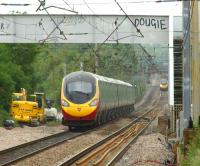 Pendolinos passing at Balshaw Lane Jct on 23 June 2013. On the left is a northbound service which is crossing the junction, while a southbound service is approaching on the right.<br><br>[John McIntyre 23/06/2013]