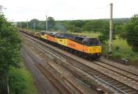 Colas Rail Freight 47739 hauls 56087 and a rake of sleeper wagons from Carlisle to Washwood Heath on 23 June 2013. Photographed just south of Balshaw Lane Junction.<br><br>[John McIntyre 23/06/2013]