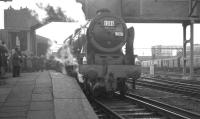 A grey and overcast February morning at Crewe in 1965 sees Royal Scot 46115 <I>Scots Guardsman</I> about to leave with the RCTS (Lancs & North West Branch) <I>Rebuilt Scot Commemorative Railtour</I> bound for Carlisle. [See image 34561]<br><br>[K A Gray 13/02/1965]