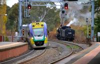 On 22 May 2013 the 10.15 Melbourne Southern Cross - Bendigo <I>VLocity</I> dmu runs into Castlemaine, while the VGR's K190 2-8-0 runs round its train to form the 11.45 to Maldon.  <br><br>[Colin Miller 22/05/2013]