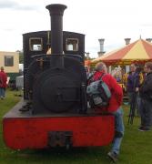 <I>'Thank you for asking Michael, it's quite the most comfortable saddle tank I've ever sat on'</I>. Hunslet 554 <I>Lilla</I>, a 23.5 inch gauge 0-4-0 built in 1891 for the Cilgwyn Slate Co. of Nanntle, provides a supporting role at this year's McAlpine garden party.<br><br>[Ken Strachan 18/05/2013]