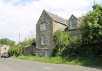 The old Bellingham station, closed in 1956, as seen from the road into the village from Redesmouth. It was later used as Council offices but has a plaque identifying its former role. [See image 1843] for the platform side view.<br><br>[Mark Bartlett 07/06/2013]