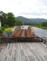 View across the open Banavie rail swing bridge from the adjacent road bridge on 25 June 2013. <br><br>[David Pesterfield 25/06/2013]