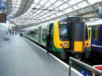 Scene on platform 8 at Liverpool Lime Street station on 21 June 2013. London Midland 350241 is preparing to depart with a service to Birmingham New Street. <br><br>[Veronica Clibbery 21/06/2013]