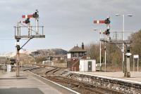 A pleasant spring day at Barrow-in-Furness in 2002 with a reasonable amount of traditional signalling equipment still to be seen at the north end of the station. In the background a class 153 single car unit (153 316) waits to form the 14:57 departure to Carlisle.<br><br>[Bill Jamieson 13/04/2002]