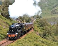 <I>The Jacobite</I>, hauled by Black 5 No 44871, makes light work of the 1 in 50 gradient between Glenfinnan Viaduct and the station on 26 June with the afternoon Fort William - Mallaig service.<br><br>[John Gray 26/06/2013]