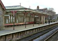 Some fine ironwork on the down side platform canopy at Grange-over-Sands in April 2002.<br><br>[Bill Jamieson 12/04/2002]