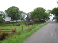 Northern approach to Forsinard Station along the A897 on 23 June. The old North signal box stands on the left [see image 16559].<br><br>[David Pesterfield 23/06/2013]