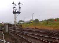 An unusual view from the Vintage Trains site at Tyseley on a grey 23 June, showing a 9-coach class 170 formation snaking slowly into the London Midland depot.<br><br>[Ken Strachan 23/06/2013]