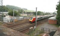 The 14.00 Virgin Trains Glasgow Central - Birmingham New Street runs non-stop through Lockerbie on 11 June.<br><br>[John Furnevel 11/06/2013]