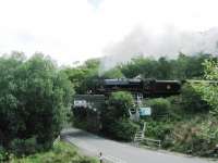 45407 takes the morning <I>Jacobite</I> westwards crossing the A830 on the approach to Beasdale station on 26 June 2013. Bury stablemate 44871 was also in use that day on the afternoon service. <br><br>[Malcolm Chattwood 26/06/2013]