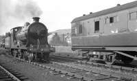 Preserved ex-NBR 4-4-0 no 256 <I>Glen Douglas</I> at Langholm with the SLS/MLS <I>Carlisle Railtour</I> on 6 April 1963. The locomotive is in the process of running round its train prior to returning to Carlisle. <br><br>[K A Gray 06/04/1963]