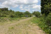 A rather depressing view of the site of Newcastleton station on the Waverley line looking north from the level crossing. Since closure in 1969 everything has been swept away. [See image 30124] for a similar view taken 44 years earlier.<br><br>[Mark Bartlett 07/06/2013]