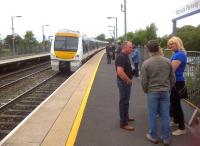 Contrasting styles at Warwick Parkway: the suits in the background pay close attention to the 15.16 to Marylebone; while the more casually dressed passengers in the foreground are so busy chatting that they might just miss it.<br><br>[Ken Strachan 02/07/2013]