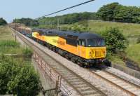 <I>Two for the price of one</I>. The Carlisle to Chirk logs on Saturday 6th July was headed by two Class 56 locos that were returned to the main line by Colas in 2013. 56105 and 56087 power the long train of timber south in the summer sunshine at Woodacre near Garstang.<br><br>[Mark Bartlett 06/07/2013]