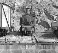 Regular steam working from Regua along the Linha do Corgo to Chaves had ceased around 1978, but in the early eighties there were still plenty of the CP's unique 2-4-6-0T metre gauge Mallets dumped around the depot yard. In typical condition was No E212, whose final resting place was a short road off the dual gauge turntable.<br><br>[Bill Jamieson 17/09/1982]