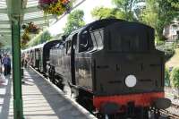 Train arriving at Swanage on 8 July 2013 hauled by BR Standard Class 4 2-6-4T no 80104.<br><br>[Peter Todd 08/07/2013]
