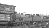 LMS 2P 4-4-0 no 40670 stands alongside platform 4 at Carlisle in March 1960. The locomotive was allocated to 68B Dumfries at that time, the shed from which it was eventually withdrawn in December 1962.<br><br>[K A Gray 03/03/1960]