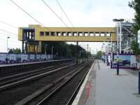 The footbridge from the new station building at the north end of the up platform at Wakefield Westgate on 9 July 2013, complete with down side lift tower but still to have steps put in place.<br><br>[David Pesterfield 09/07/2013]