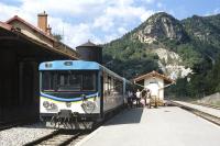 The small town of Annot is situated in the valley of the Vaire river midway between Nice and Digne-les-Bains on the Chemins de Fer de Provence. Here the mid-day train from Nice has stopped to detach the rear railcar, allowing passengers to stretch their legs. Occasional Railscot contributor Ingrid Jamieson is standing in front of the luggage trolley.<br><br>[Bill Jamieson 01/09/2004]