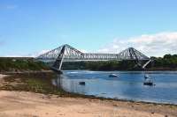 The cantilever Connel Ferry Bridge that once carried the Ballachulish branch with the Falls of Lora beneath. Originally railway only, it was adapted to accommodate both road and rail traffic in 1914. It was too narrow for simultaneous use so road traffic was stopped when trains crossed. The Branch closed in 1966 and the bridge given over to road traffic and pedestrians. [See image 33502]<br><br>[John Gray 10/07/2013]