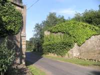 One of two pairs of bridge abutments to the south of Roxburgh station, photographed on 7 July 2013. This pair carried the NB line towards Kelso and on to Tweedmouth. [See image 25446]<br><br>[John Yellowlees 07/07/2013]