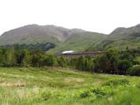 Preserved Black 5 no 45407 takes the morning <I>Jacobite</I> westwards over Glenfinnan Viaduct on 26th June 2013.<br><br>[Malcolm Chattwood 26/06/2013]