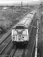 305 501 passes the new station construction at Wallyford with the 13.37 Edinburgh - North Berwick service on 1 March 1994.<br><br>[Bill Roberton 01/03/1994]