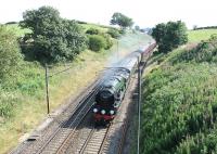 More new steam in 2013.  Newly returned to the main line, West Country 4-6-2 34046 <I>Braunton</I> ventured out from the East Lancashire Railway on 16 July and took a test train round the Carnforth - Helifield circuit. Running well ahead of schedule the gleaming Pacific, restored from a Barry wreck, is seen here heading towards Lancaster at Forton.<br><br>[Mark Bartlett 16/07/2013]