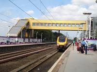 The new footbridge at Wakefield Westgate on 15 July, with down side stairway added over the previous week. CrossCountry Voyager 221130 runs in to form the 12.23 service to Plymouth.<br><br>[David Pesterfield 15/07/2013]