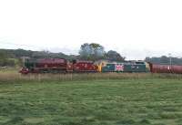 17th July saw 45699 <I>Galatea,</I> in BR lined maroon livery, on its first <I>Fellsman</I> outing since restoration. Because of the dry conditions the Jubilee had diesel assistance in both directions. As West Coast have a large fleet of maroon Brush 4s, the decision to put large logo 47580 between 45699 and its coaches left linesiders puzzled. The train is heading home at Woodacre in the fading sunlight.<br><br>[Mark Bartlett 17/07/2013]