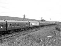 Glasgow Fair Saturday, 16th July 1966, sees an up special passing Craigenhill Summit behind an EE Type 4.<br><br>[Colin Miller 16/07/1966]