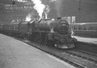 Black 5 45126 prepares to leave Edinburgh's Princes Street terminus on 18 May 1964 with the 1.20pm service to Lanark.<br><br>[K A Gray 18/05/1964]