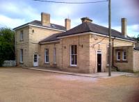 The former station building at Linton (1865-1967), south of Shelford on the former Cambridge to Haverhill route, has evidently been looked after in its recent uses as office space and school. The big squared-off office block out of shot to the right (sadly, built across the trackbed) doesn't look quite so nice.<br><br>[Ken Strachan 20/07/2013]