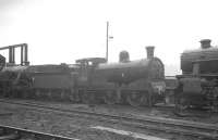 Caley 0-6-0 57592 stands in the shed yard at Eastfield in 1963.<br><br>[K A Gray //1963]
