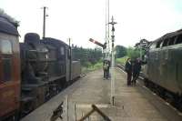 Integrated rail transport, but not for much longer. Steam meets diesel at St Boswells on the station's last day as a passenger junction, 13th June 1964. The footplate crew of the Standard Class 2 2-6-0 heading the 4.2 pm branch train to Kelso and Berwick (the last ever eastbound service) chat to the driver of the English Electric Type 4 hauling the 2.43 pm Edinburgh to Carlisle service.<br><br>[Frank Spaven Collection (Courtesy David Spaven) 13/06/1964]