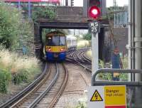 A Watford junction train leaving Willesden Junction on 20 July, seen from the low level platforms shared with the Bakerloo Line. <br><br>[John Thorn 20/07/2013]