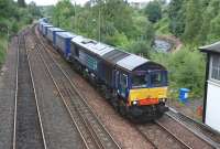 DRS 66303 about to pass Dunblane signalbox on 22 July 2013 with the Inverness - Mossend intermodal service.<br><br>[Bill Roberton 22/07/2013]