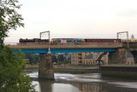 The returning <I>Fellsman</I> has just dropped the final passengers at Lancaster on 24 July and now the ECS is crossing the River Lune on Carlisle Bridge heading for Carnforth. K4 61994 was assisted by <I>Stratford</I> liveried 47580 as a fire risk precaution, but perhaps also celebrating the birth of Prince George two days earlier.<br><br>[Mark Bartlett 24/07/2013]