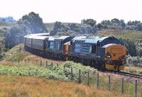 The luxury Pullman <I>Northern Belle</I> pictured climbing the gradient between Invershin and Lairg on 20 July hauled by Class 37's 37423 <I>Spirit of the Lakes</I> and 37409 <I>Lord Hinton</I>. 37425 is attached at the rear of the train.<br><br>[John Gray 20/07/2013]