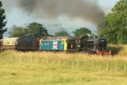 The return <I>Fellsman</I> on the climb out of the Ribble Valley approaching Wilpshire Tunnel in the early evening sunshine of 24 July 2013. Gresley K4 2-6-0 no 61994 <I>The Great Marquess</I> leads 47580 <I>County of Essex</I>, with the 47 provided due to the high fire risk - although at this point the K4 appears to be doing most of the work.<br>
<br><br>[John McIntyre 24/07/2013]